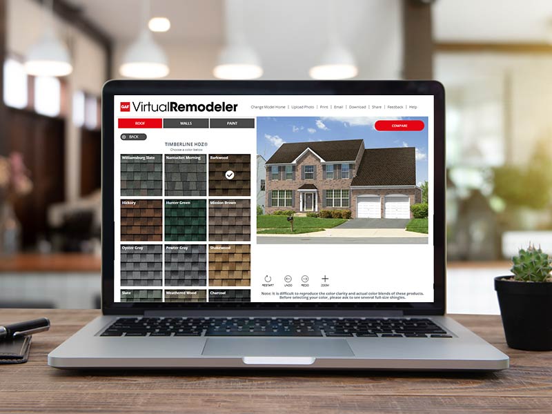 Laptop on a desk with the GAF Virtual Design Tool on the screen